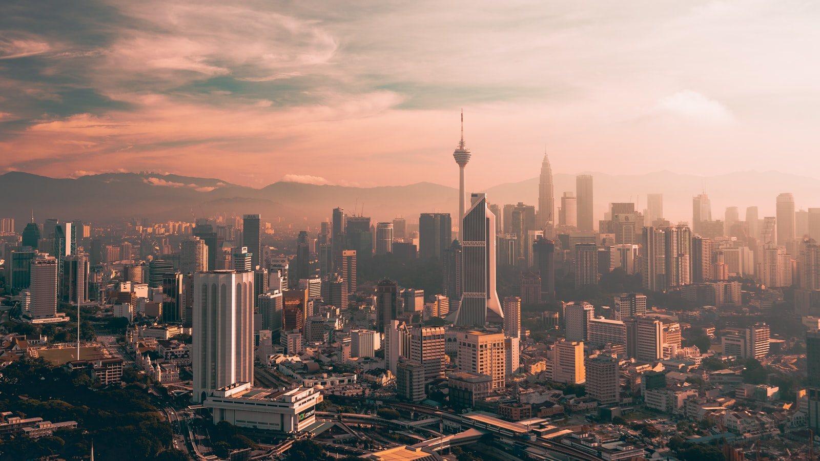 The Kuala Lumpur skyline at dusk, looking across the city centre